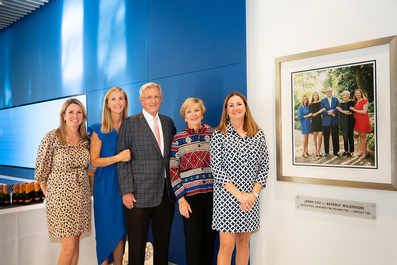 Wilkinson family with portrait in lobby
