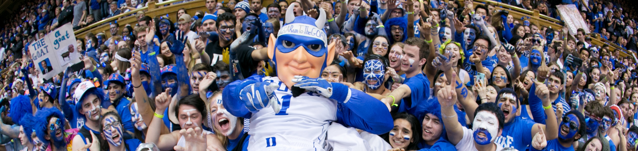 The Duke Blue Devil mascot with cheering fans at Duke University