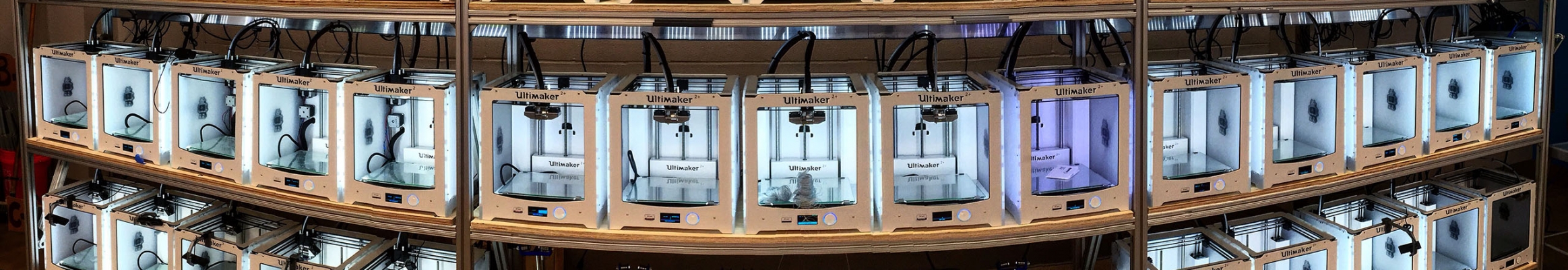 a bank of 3-D printers in the Duke Innovation Co-Lab