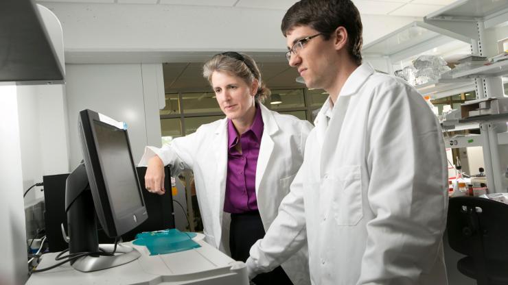 Jennifer West works with graduate student Jeffrey Ashton in her lab