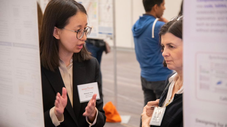 Xiaoxuan Yang presents her poster to workshop advisor and UT Austin professor Diana Marculescu Yang presents her poster to workshop advisor and UT Austin professor Diana Marculescu