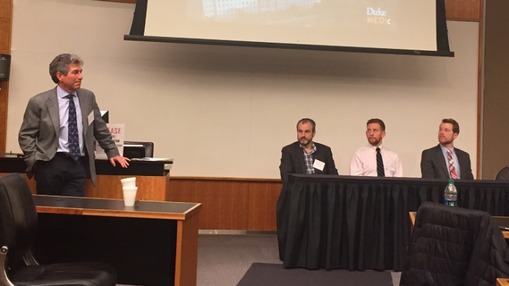 Geoff Ginsburg, director of MEDx, speaks with panel members Adam Wax, Matthew Kirley and Steven Brousell