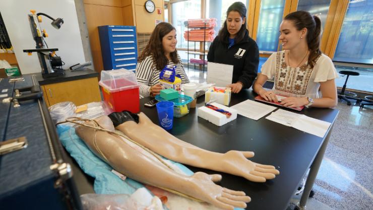 One of the first-year design teams works to develop a new model for training nurses how to insert a needle to draw blood.