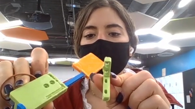 Alina Suarez with 3D printed test strip dispenser door