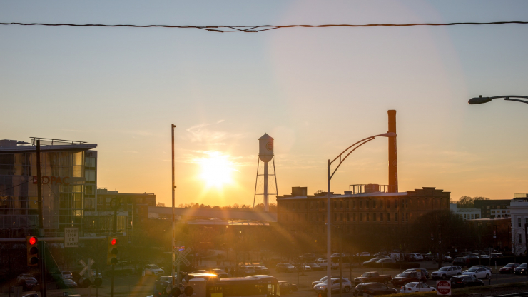 Sun rising over downtown Durham. Photo by Colin Rowley for Unsplash