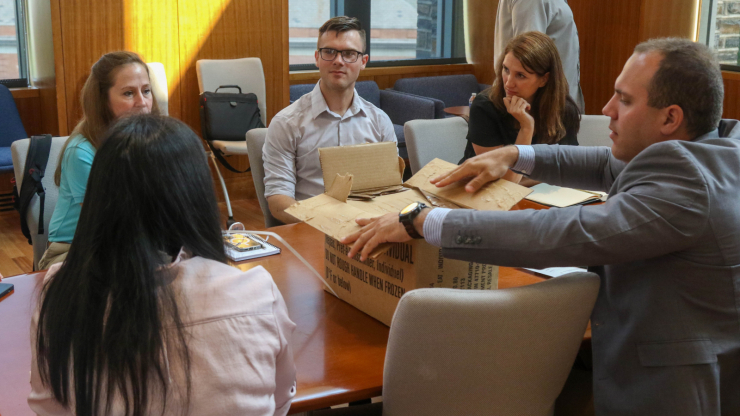 XVIII Airborne Corps Innovation Officers, Department of Defense Innovation Representatives and Duke University Faculty collaborate during a workshop on June 6, 2023 at Duke University, NC. The workshop was held to facilitate cooperation between the Department of Defense and Academia. people around a meeting table at Duke
