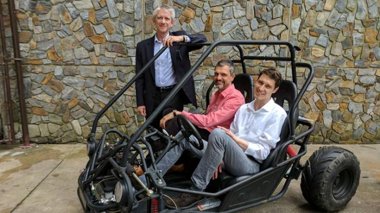 Mechanical engineering professor Josiah Knight, standing, with neuroscientists Angel Peterchev and Stefan Goetz on right. The team’s new battery and power conversion system will be the heart of this student-built vehicle for the Shell Eco-Marathon.