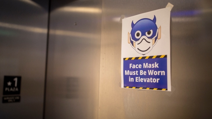 sign mandating mask in elevator