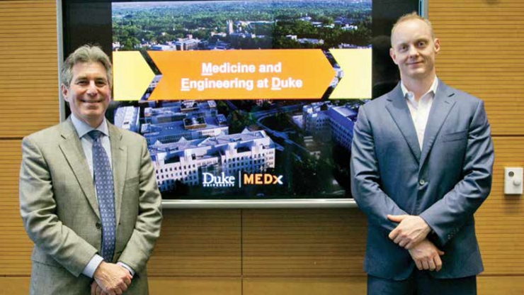 Geoffrey Ginsburg, director of MEDx, stands to the left of MEDx co-director Ken Gall, chair of the Department of Mechanical Engineering and Materials Science