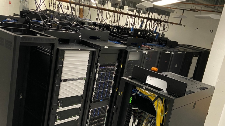 A bunch of computer servers clustered together in an IT room
