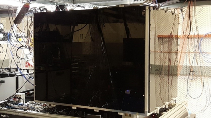 A metal box the size of a large TV with lots of wires coming out of it