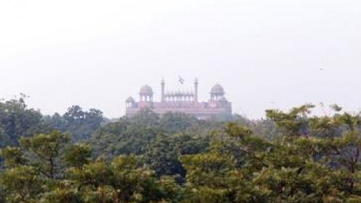 Smog hangs over the Red Fort in New Delhi, India. Some monuments in the country, like the Taj Mahal, are cleaned to remove stains created by air pollution. (Amanda Solliday / Duke University)