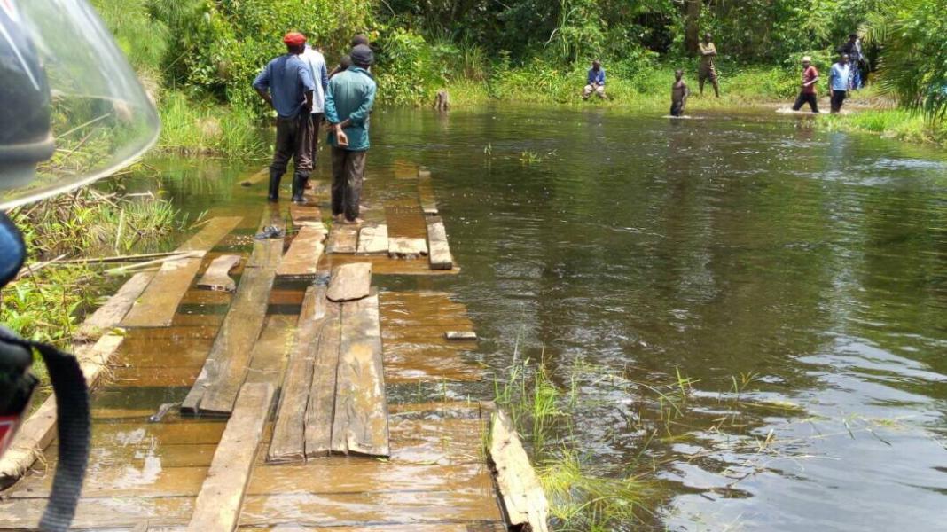 The footbridge used to travel in and out of the Kyenjojo district is submerged in the wet season 