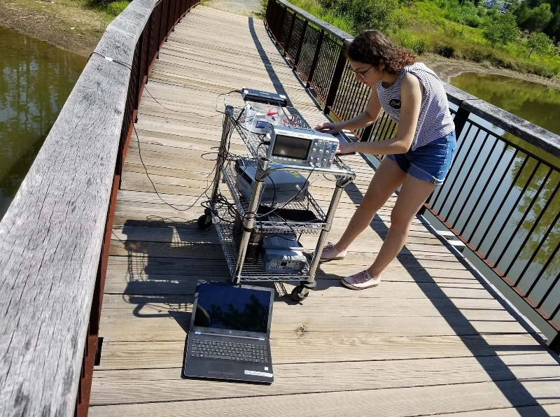 Electrical and electronics engineering student Sueda Taner tests her sonar project at the Duke Reclamation Pond