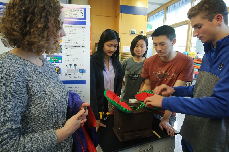 Students around a model venus flytrap