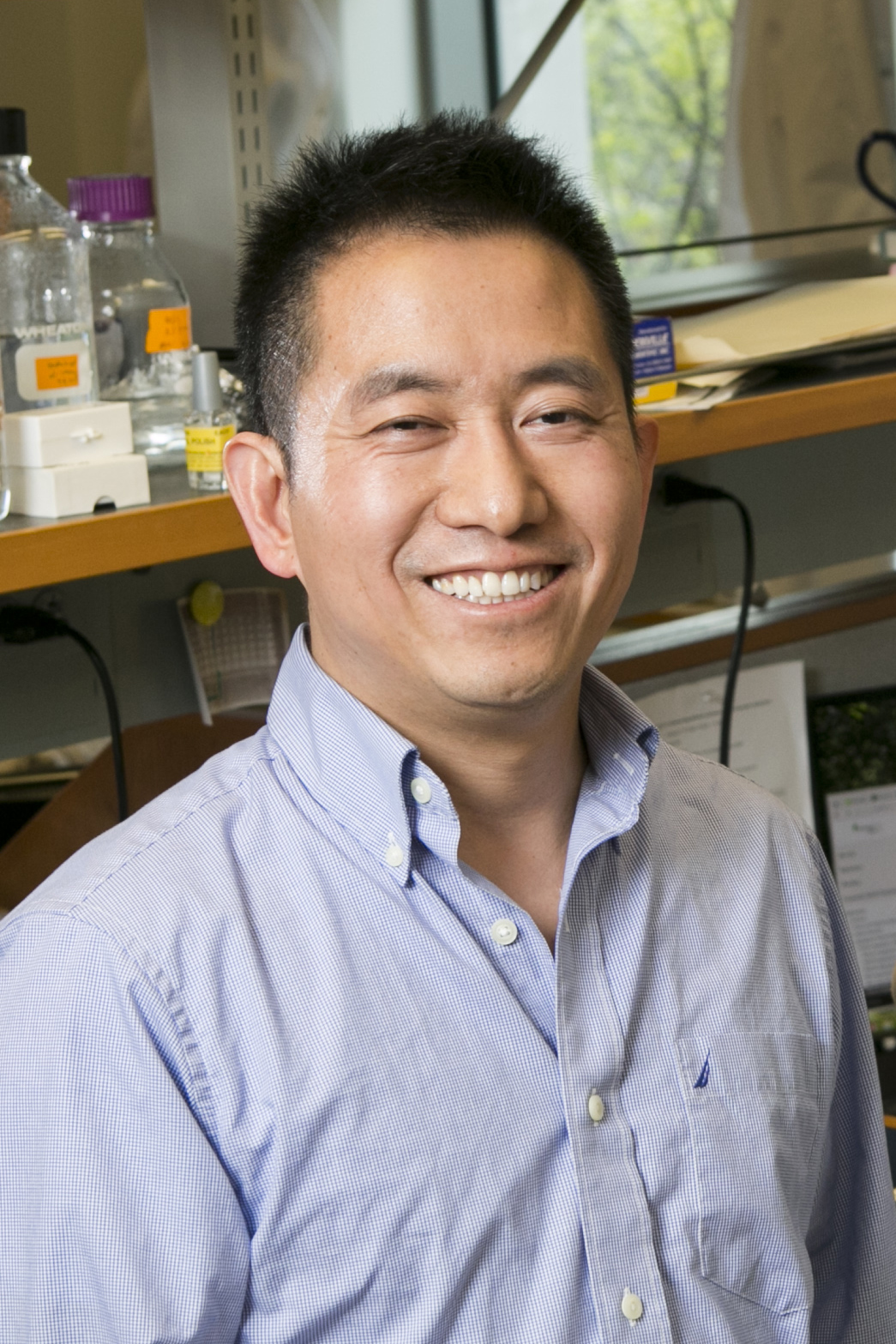 Man smiling in a laboratory