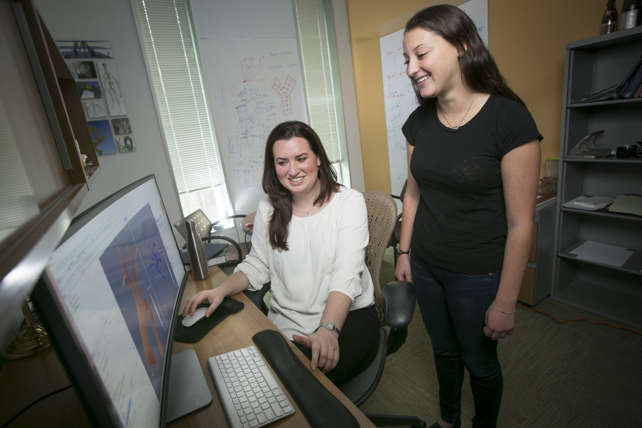 Professor Amanda Randles works with undergraduate student Stephanie Musinsky.