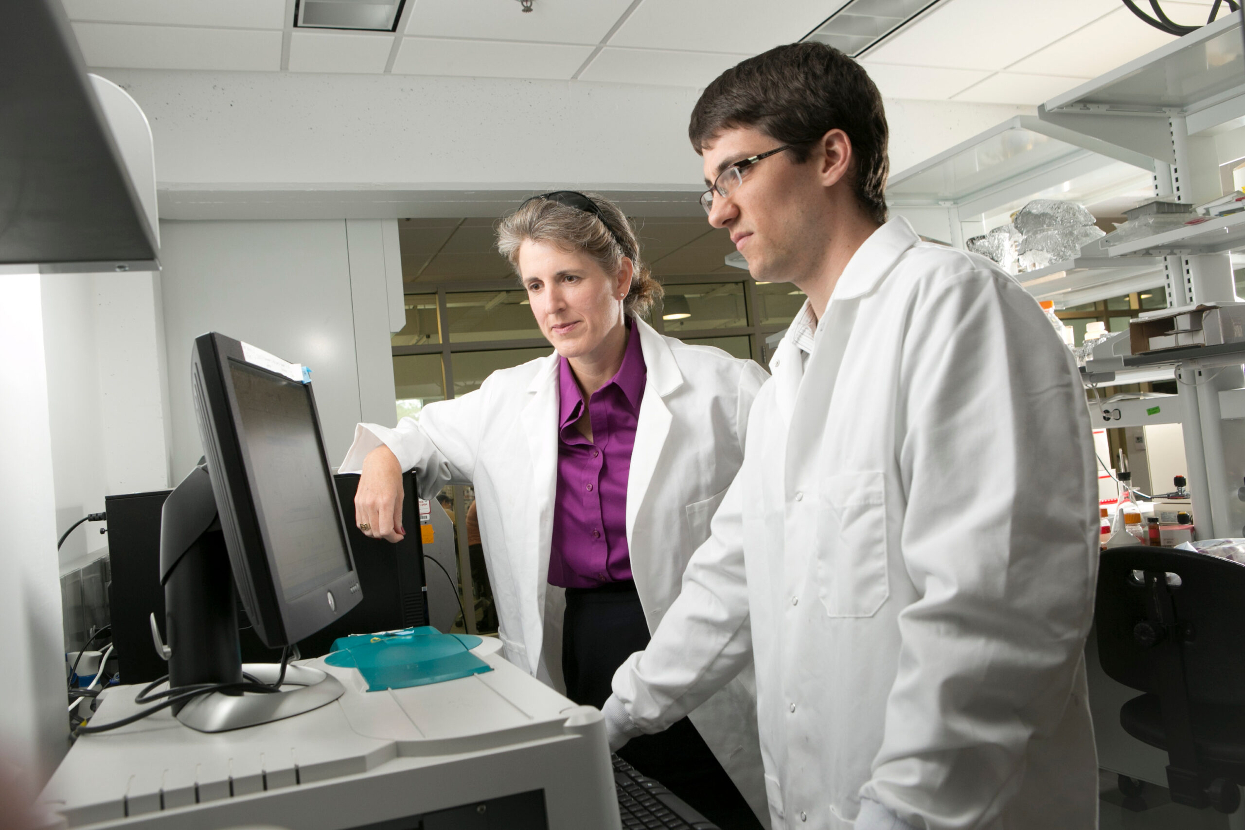 Jennifer West works with graduate student Jeffrey Ashton in her lab