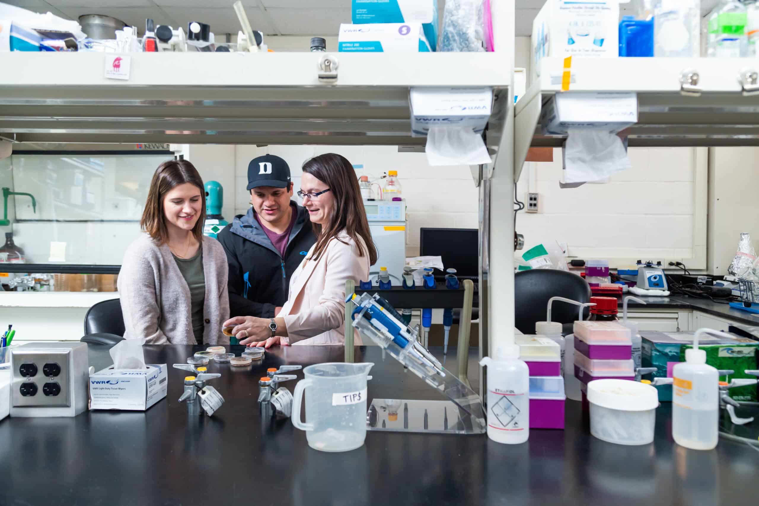 professor and two students in a environmental science laboratory at Duke University