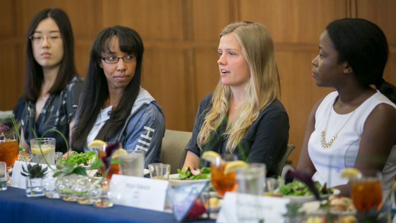 four people at a panel discussion at Duke University