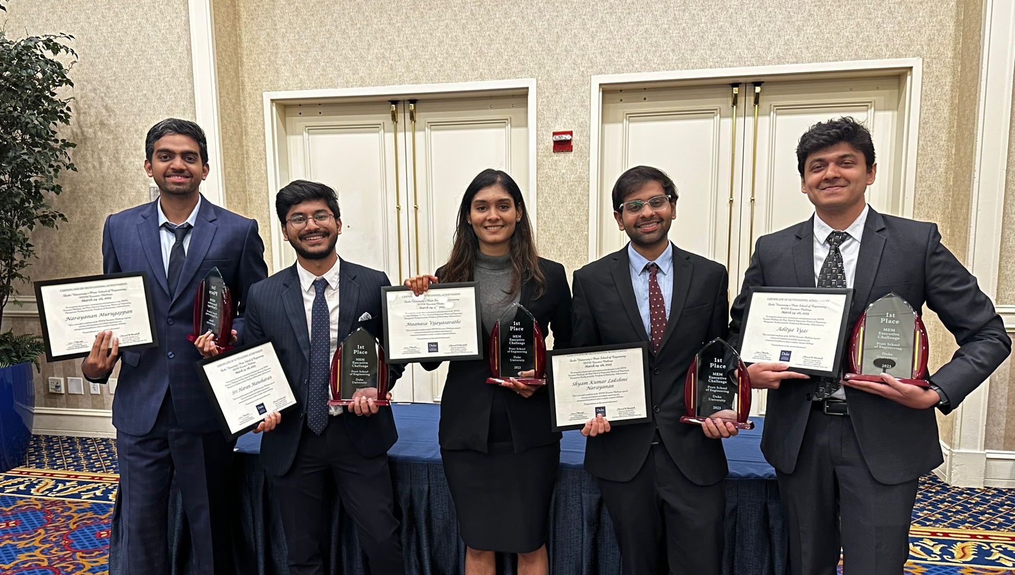 five people hold certificates