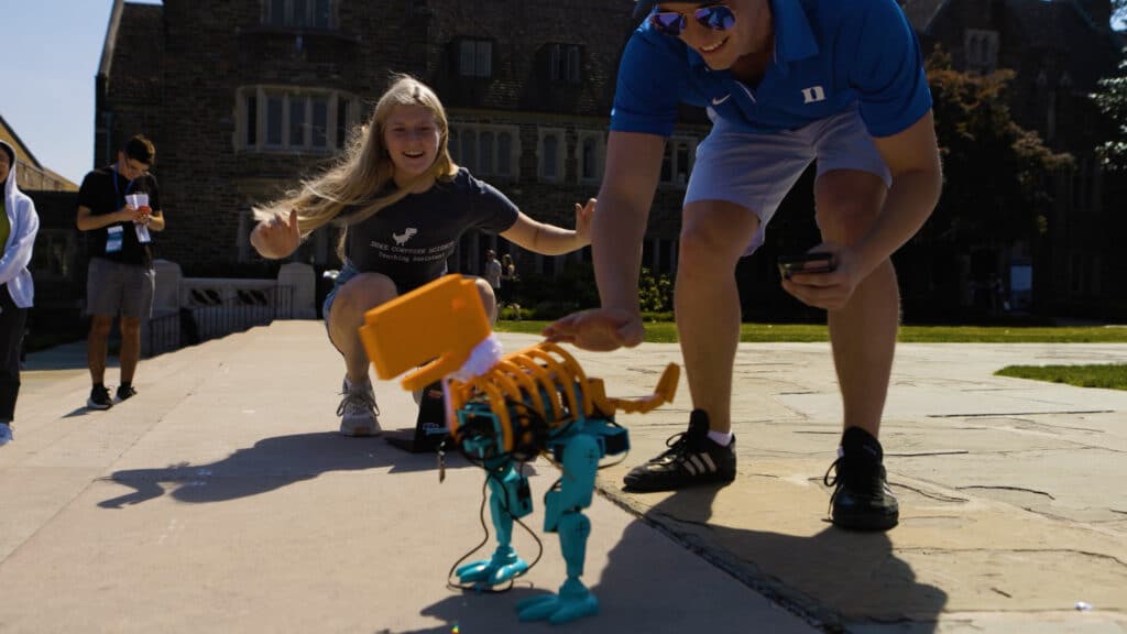 a student built-robot shaped like a T. Rex dances at Duke University
