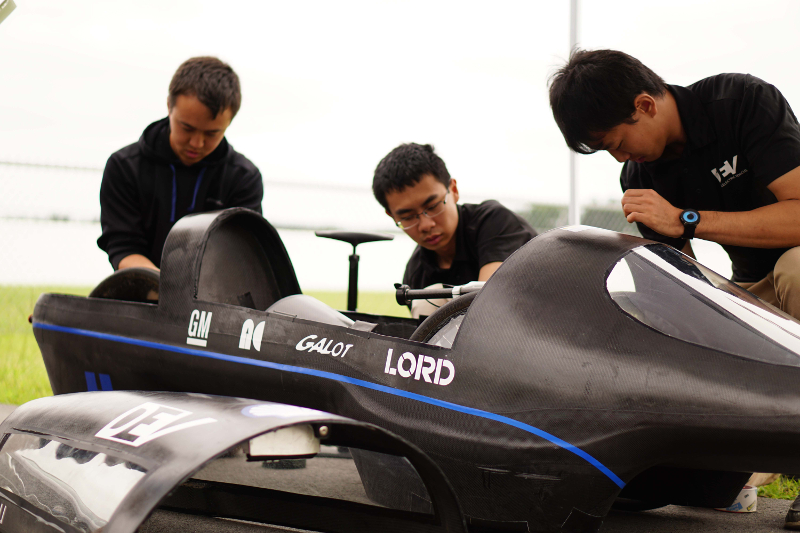 Students working on the car