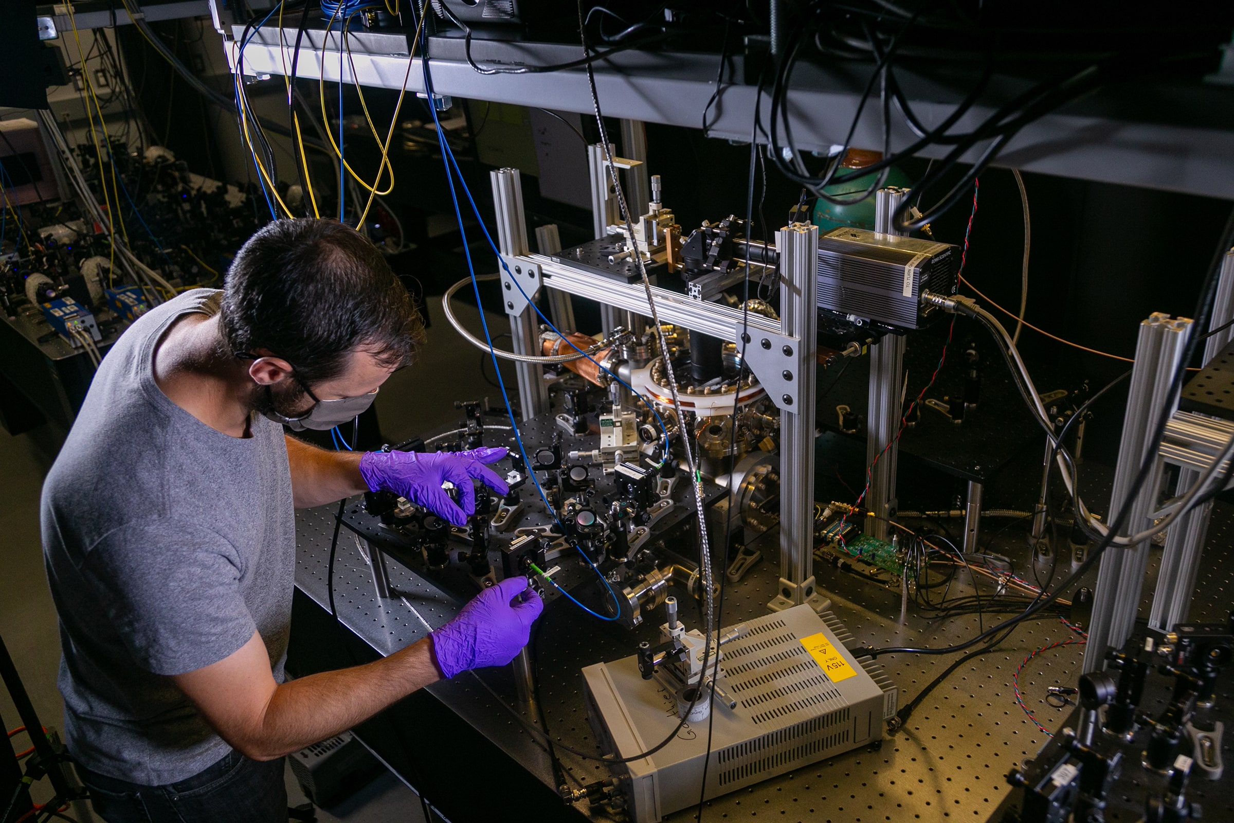 Mark Kuzyk an Electrical and Computer Engineering Postdoctoral Fellow in the Brown Lab works on a quantum computer setup.