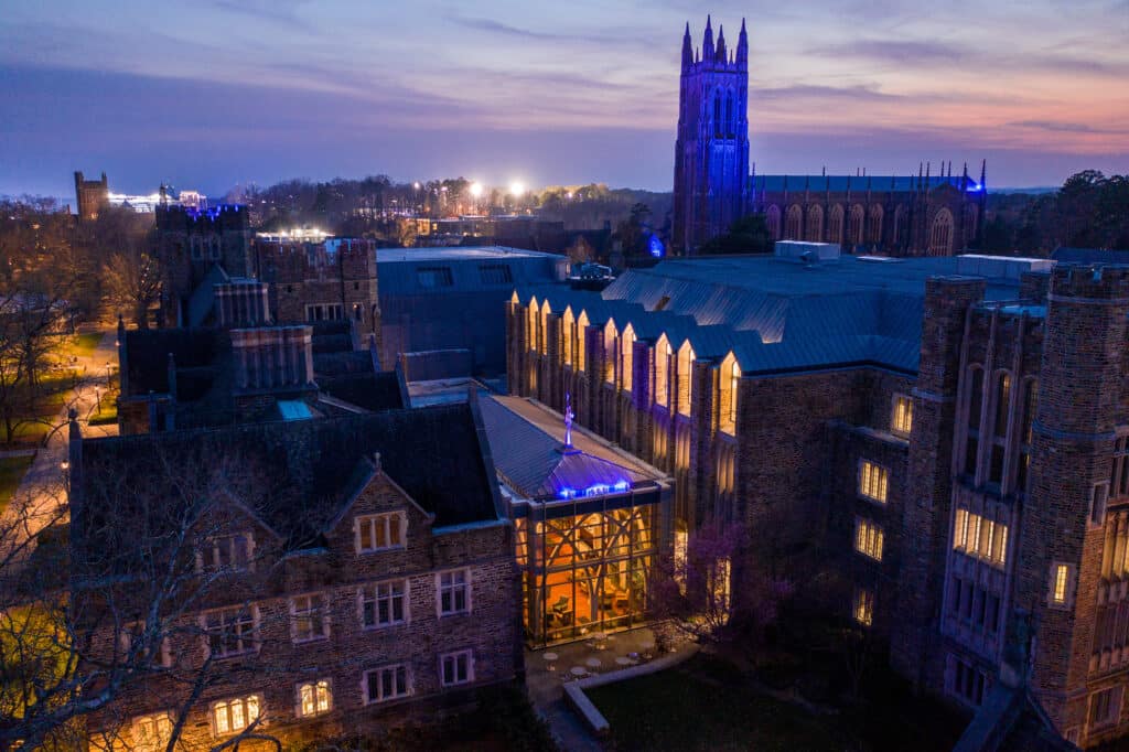 Chapel and Von Der Heyden pavilion lit up blue at dusk