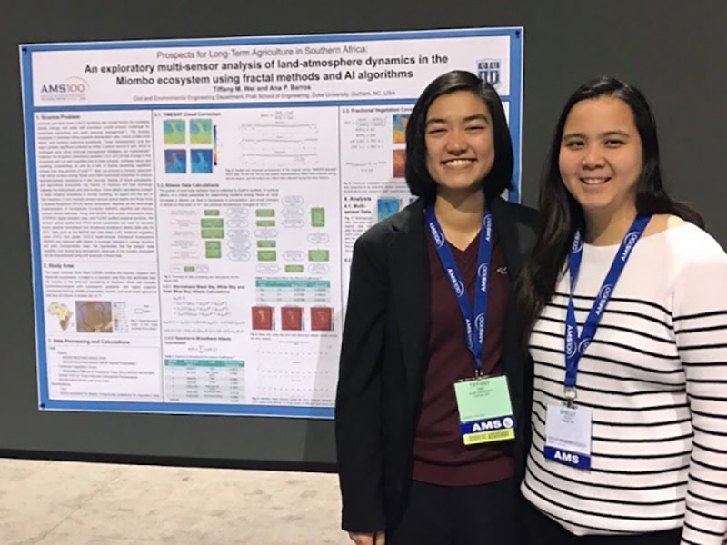 Tiff Wei and their partner, Shelly Guo, in front of Tiff’s poster, entitled, “Prospects for Long-Term Agriculture in Southern Africa: An Exploratory Analysis of Land-Atmosphere Dynamics in the Miombo Ecosystem Using Fractal Methods and AI Algorithms” at the American Meteorological Society’s 19th Annual Student Conference in Boston, MA.