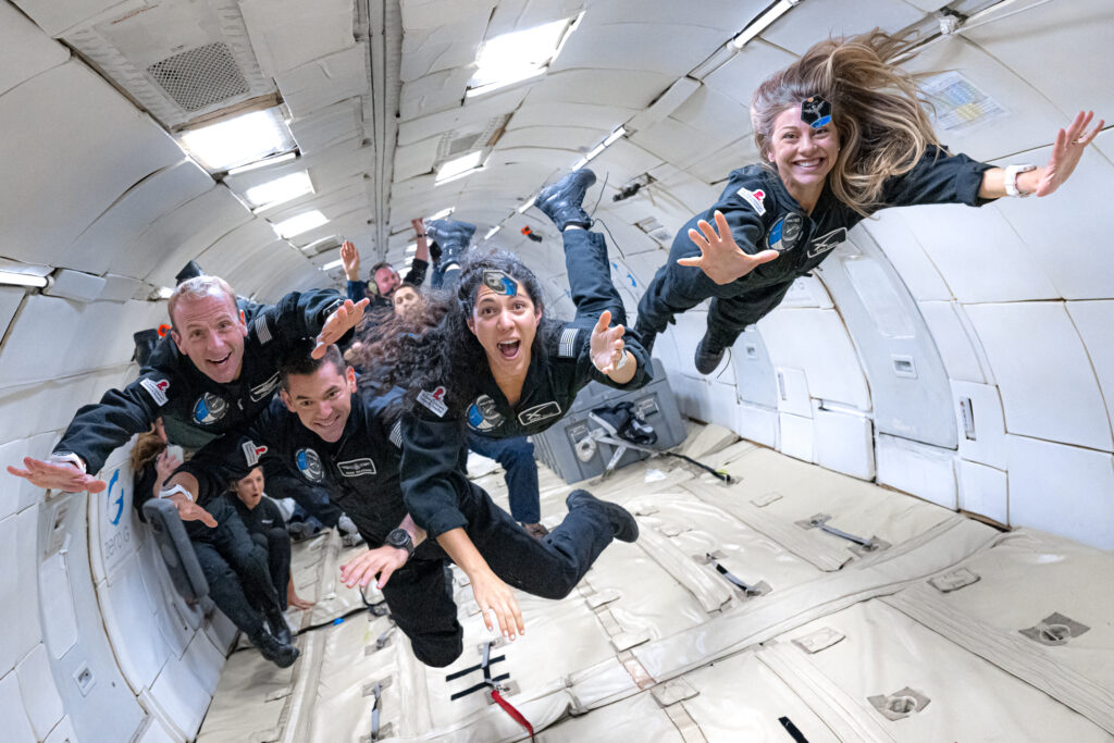 team members floating in anti-gravity