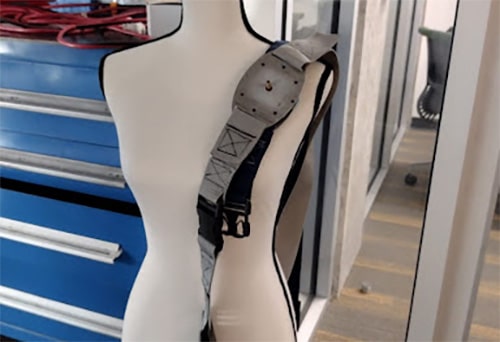 a mannikin with a strap