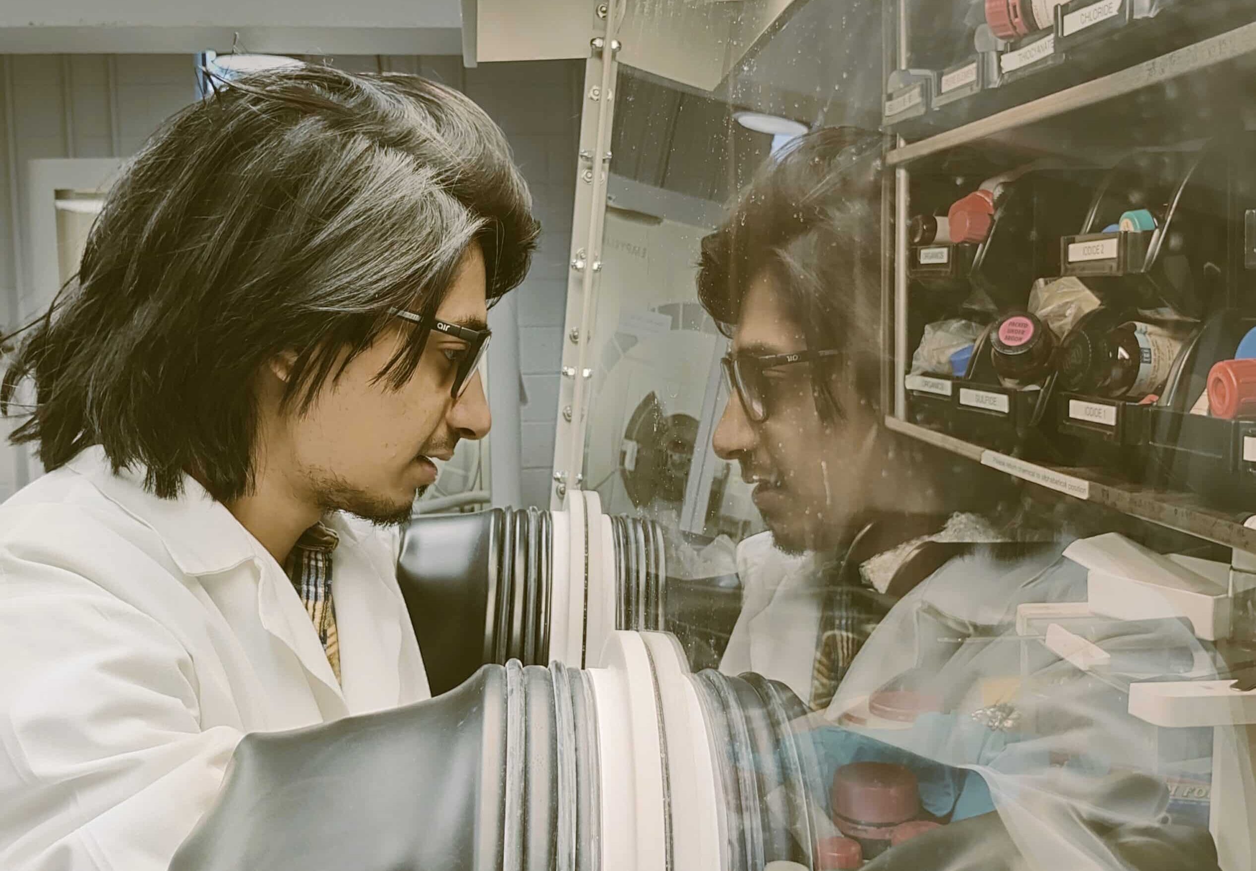 Graduate student Akash Singh working in a lab