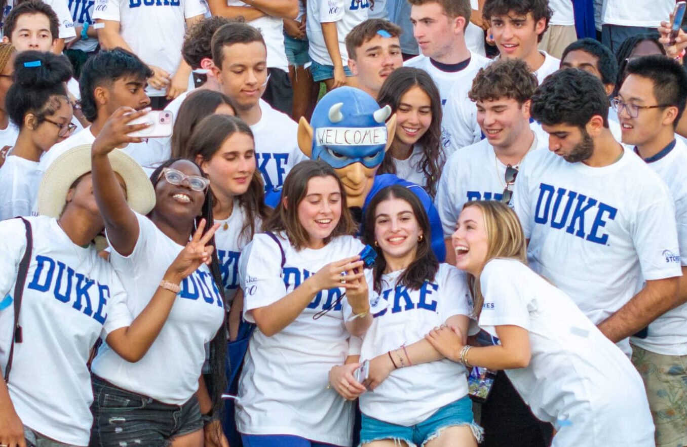 Duke students take a selfie with the Blue Devil