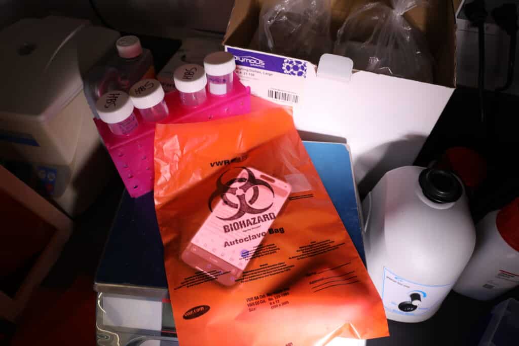 bottles and a bag with text biohazard