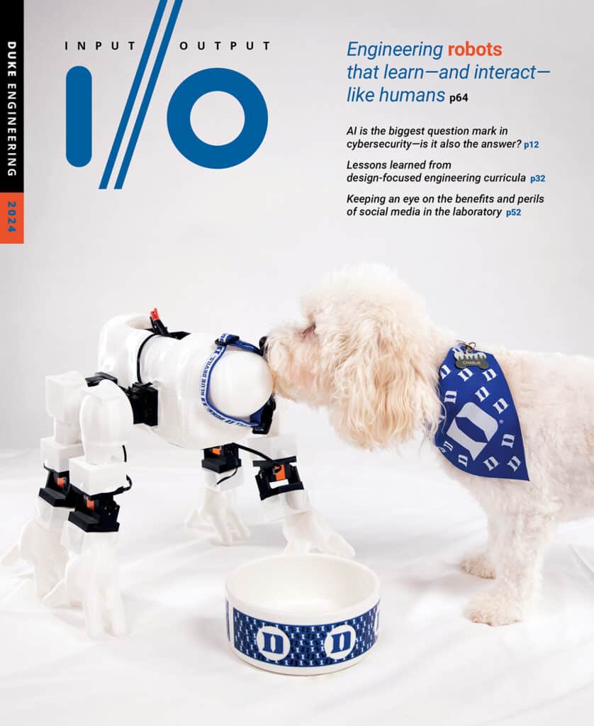 I/O magazine cover featuring a white fluffy dog with a small white dog-shaped robot