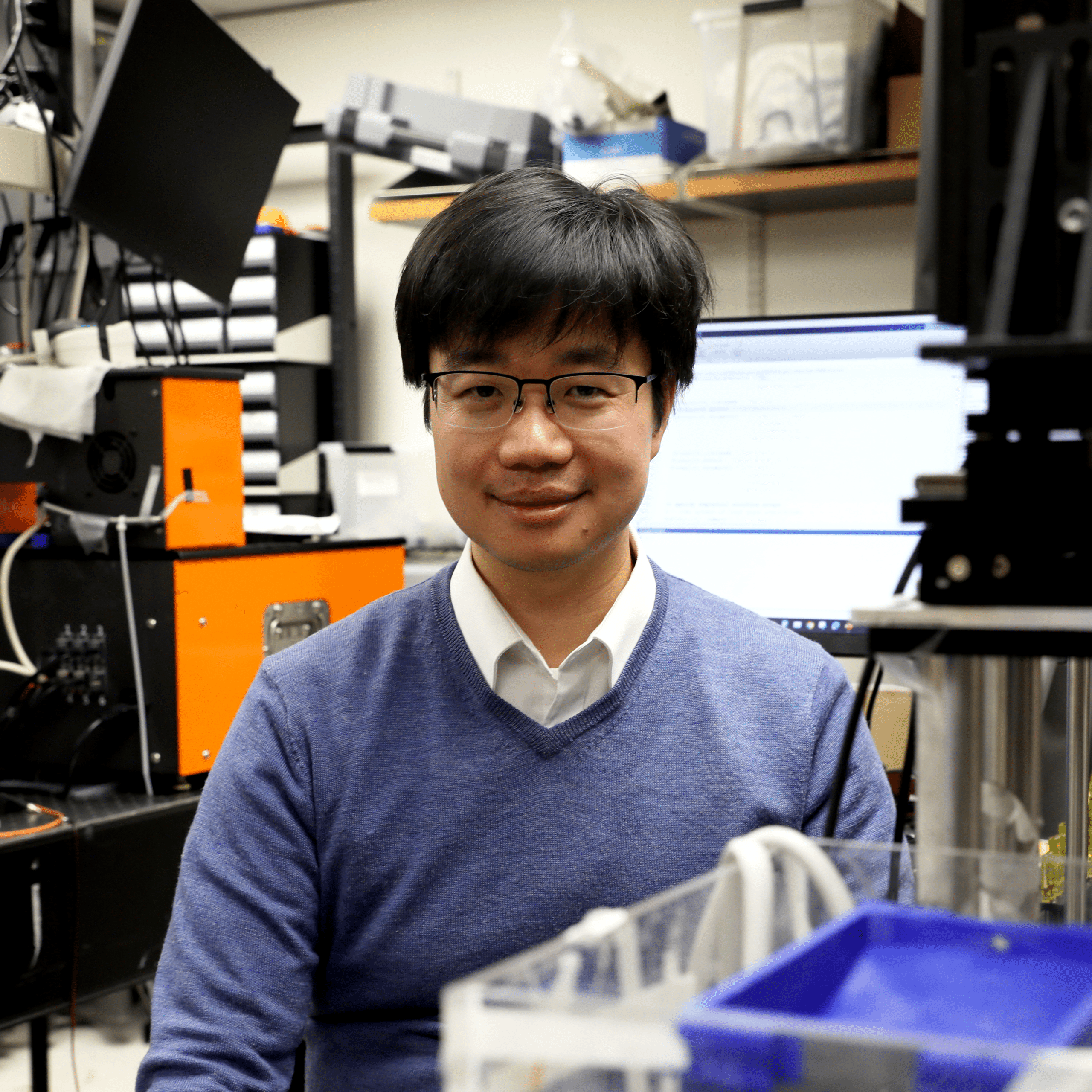 Junjie Yao poses for a portrait in his lab