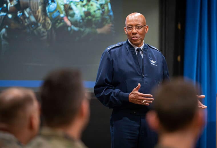 Man in military dress fatigues speaking to an audience