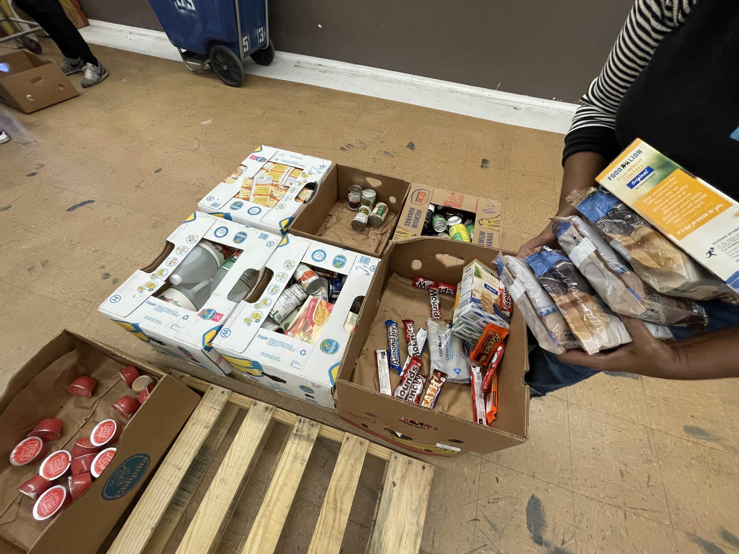 close up of hands sorting food at the Food Bank of Central and Eastern North Carolina Durham branch