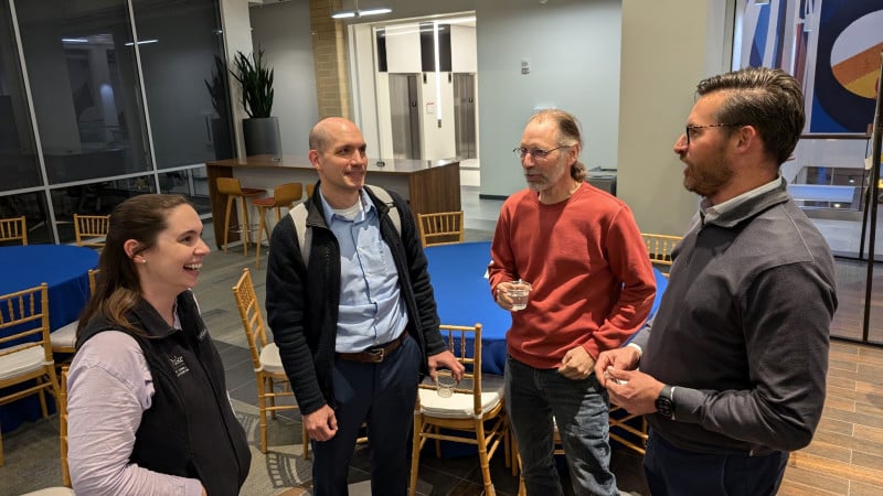 Four people have a discussion