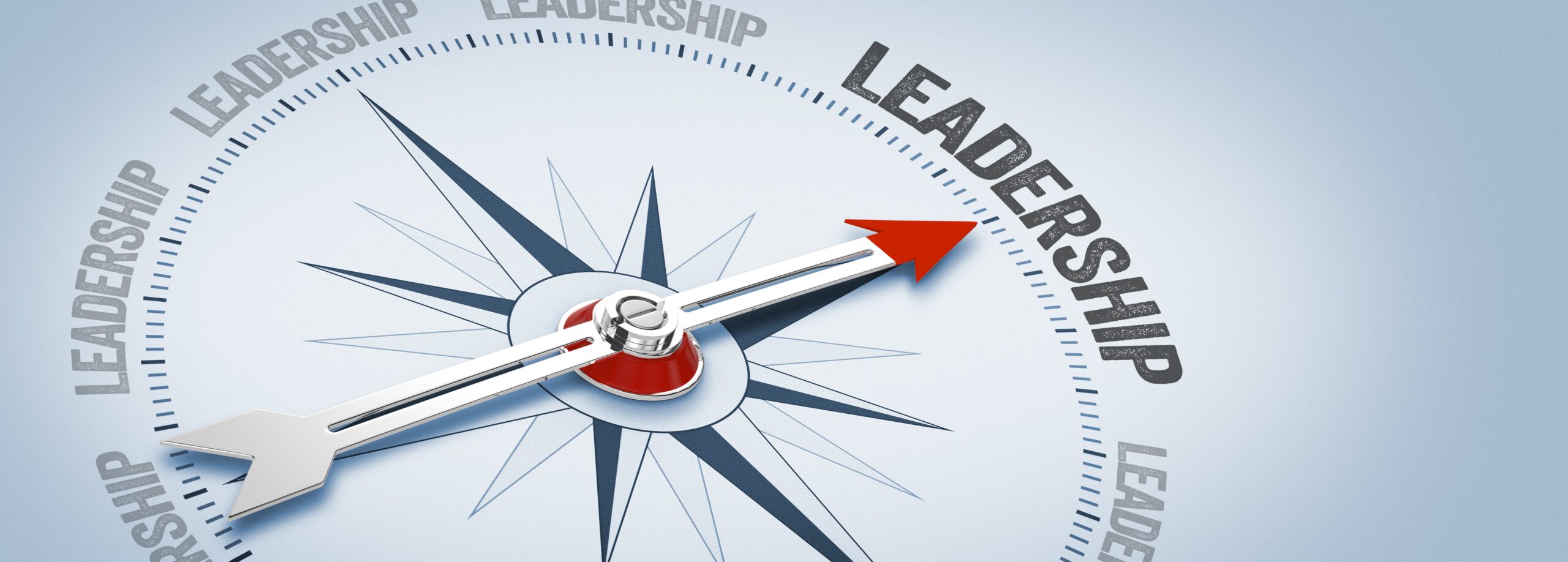 Stock image of a compass with a red arrow pointed to the word leadership