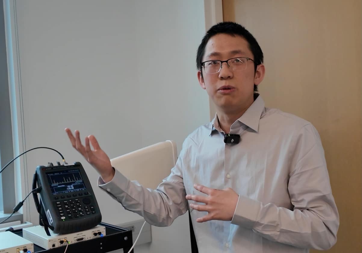 Zhihui Gao explains the WISE setup in the lab.