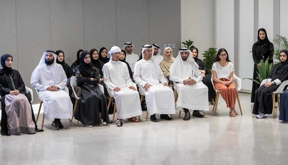 Mariam Gulamhusein sits with others recognized as top performing high school students in the UAE